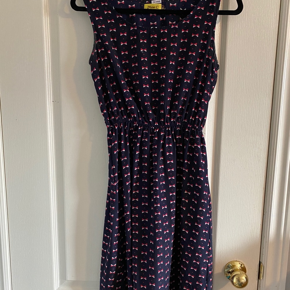 Women’s navy dress with bow detailing